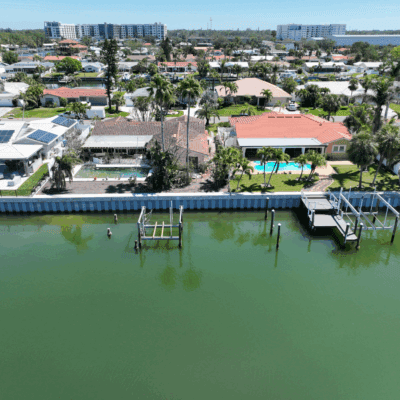 Vinyl panel seawall and concrete cap canal seawall project by Brine Marine
